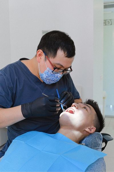 Become impacted (trapped under the gums or bone)